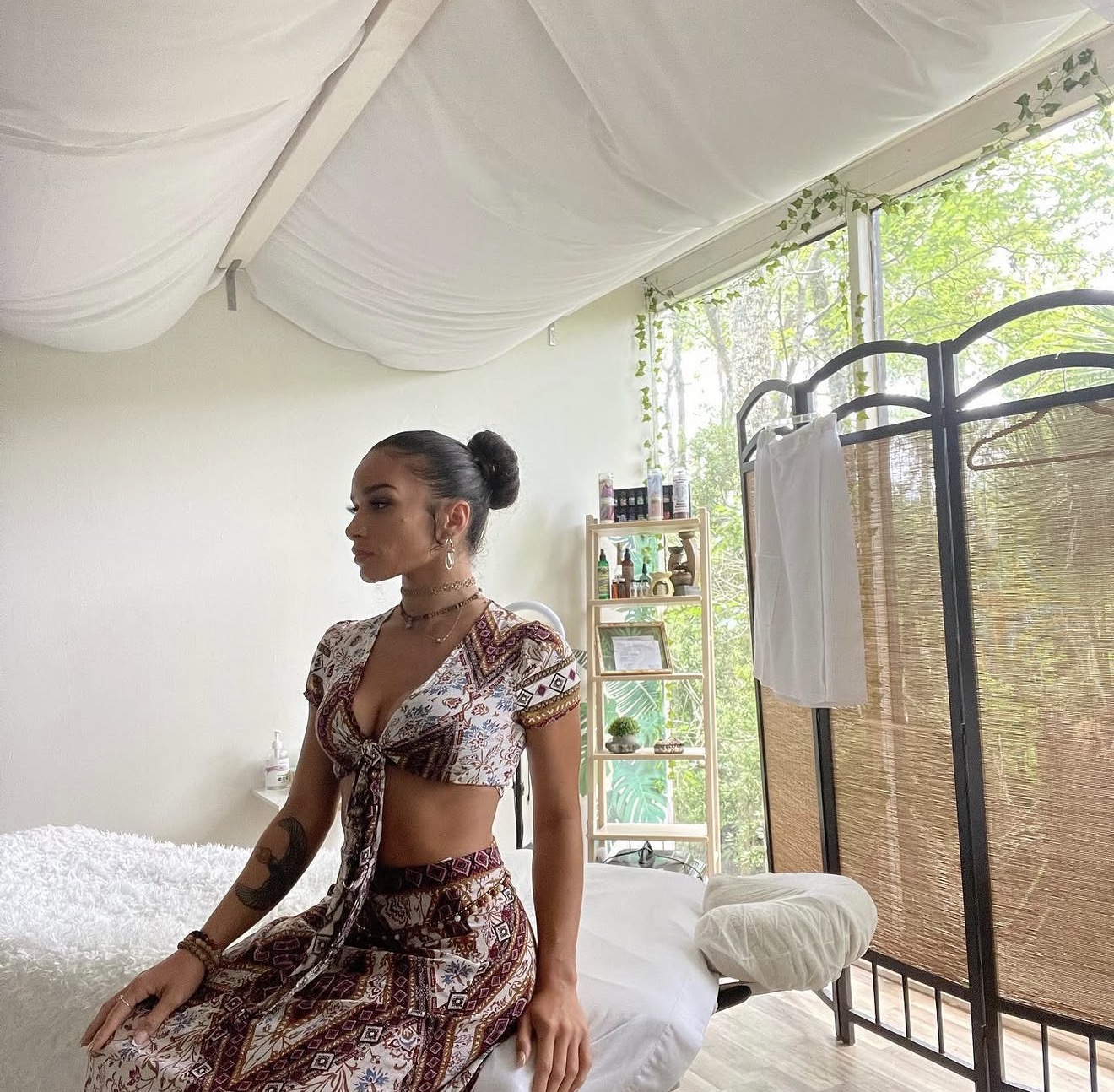 Lo Reyes founder of Post Op Mami in her massage studio